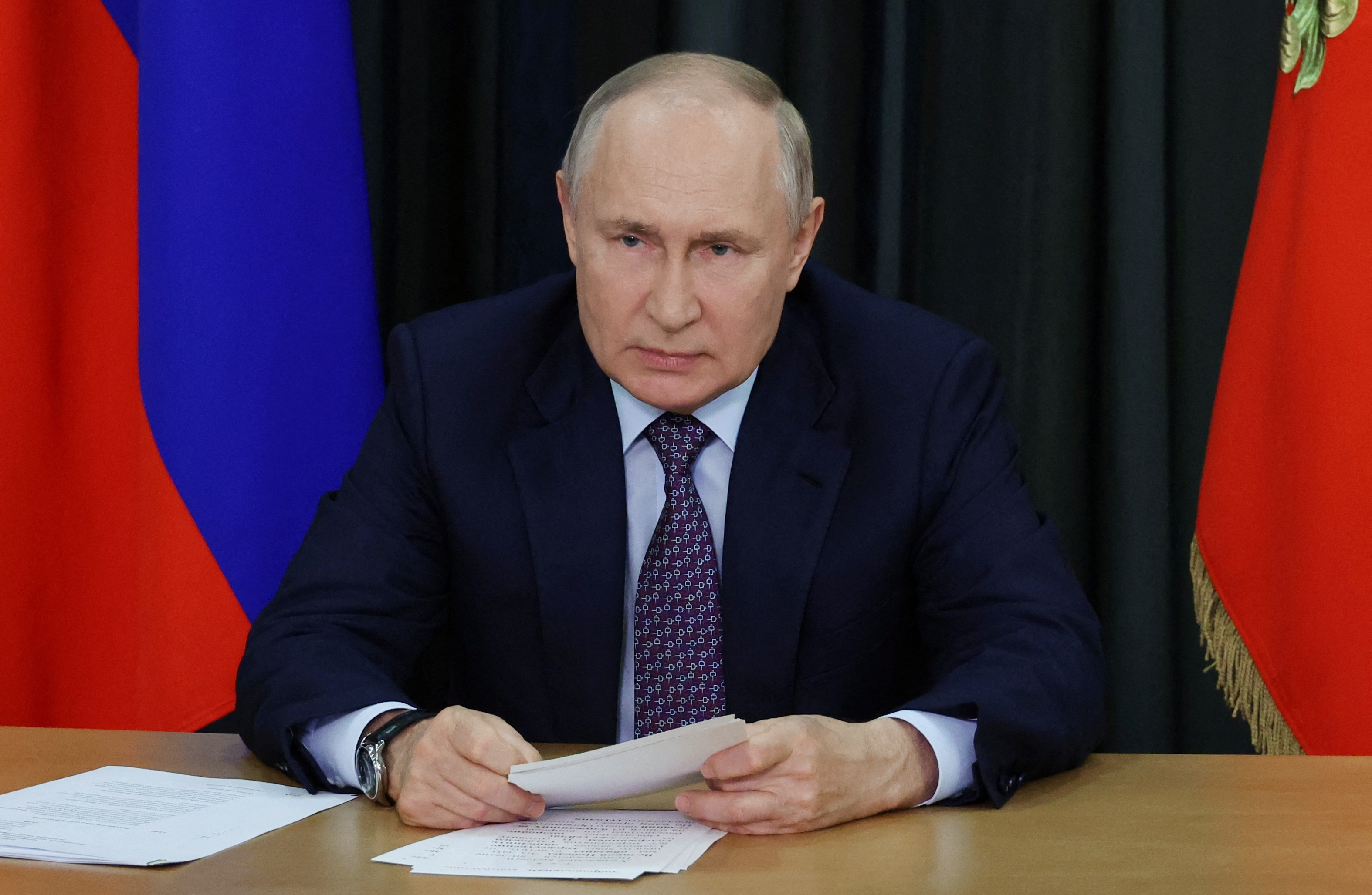 Russian President Vladimir Putin attends a meeting with the Pobeda (Victory) organizing committee via a video link in Sochi