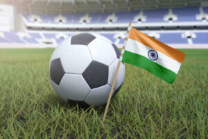 India flag in football stadium field with soccer ball on grass