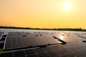 Floating solar panels on water lake. solar panels at sun light.