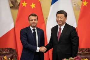 French President Emmanuel Macron shakes hands with Chinese President Xi Jinping following a signing ceremony at the Great Hall of the People in Beijing