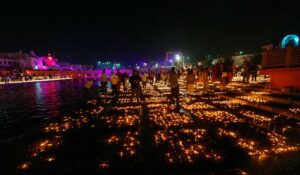 People light earthen lamps at Ram ki Pouri during Deepotsav in A