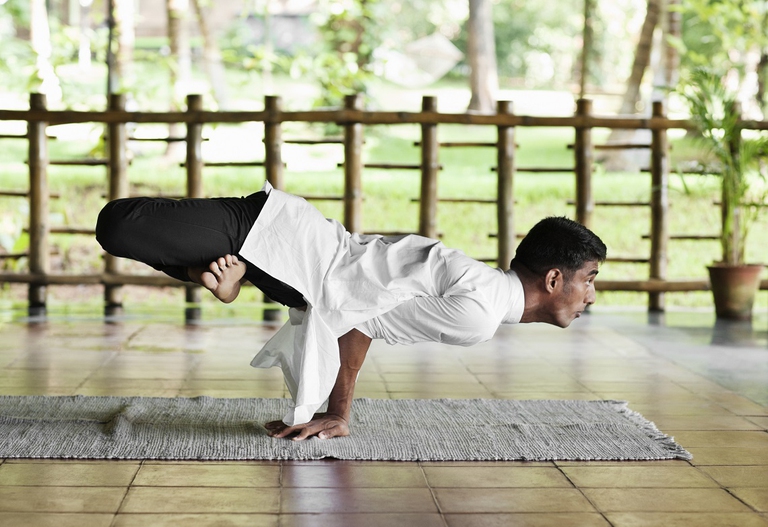 GettyImages-102719284-Man-Practicing-Yoga.