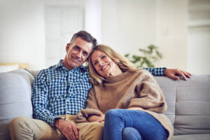 Shot of a mature couple chilling on the sofa at home